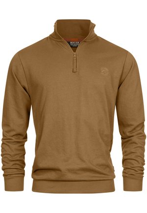 Brauner Zip-Up-Hoodie aus weichem Material. Mit hohem Kragen, langen Ärmeln und gerippten Bündchen. Dezentes Logo-Detail auf der Brust.