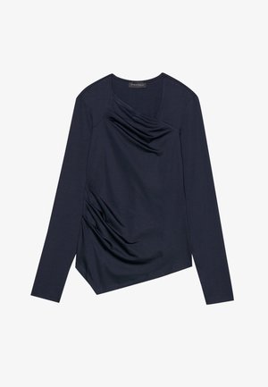 Tamnoplavi dugosleeve top s drapiranom prednjom stranom i bočnim nabiranjem. Ima V-izrez i asimetričnu donju obrubu. Glatka, rastezljiva tkanina.