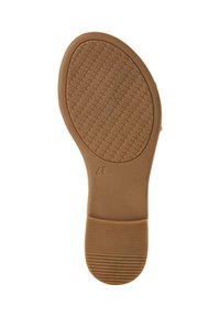 Light brown rubber shoe sole with a textured, crosshatch pattern. Features a flat heel and a rounded toe area. Size marked as 37.