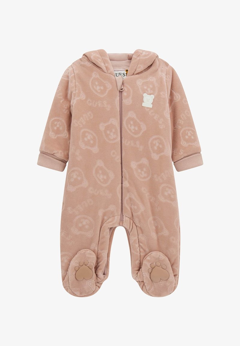 Combinaison pour bébé à capuche rose pâle avec un motif de visages d'ours, fermeture éclair sur le devant et grips en forme de pattes sur les pieds.