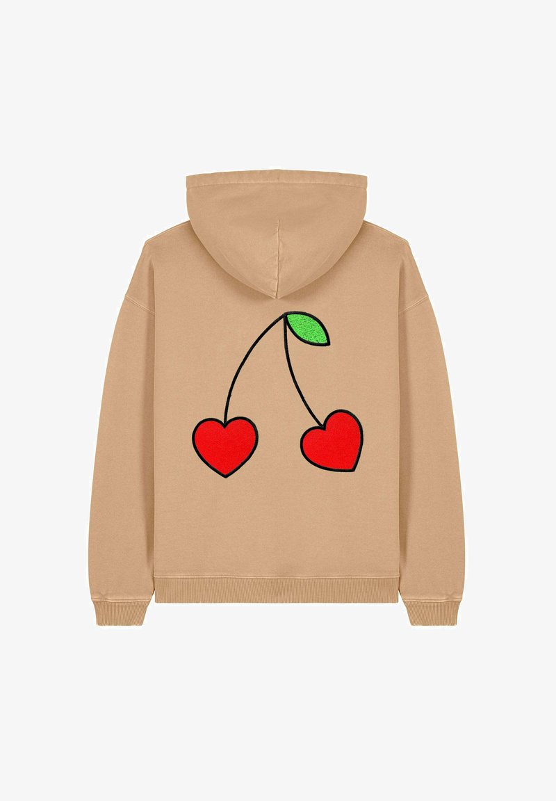 Beżowa bluza z kapturem na sznurki. Na plecach znajduje się grafika przedstawiająca dwa czerwone serca i zielony liść. Miękka tekstura materiału.
