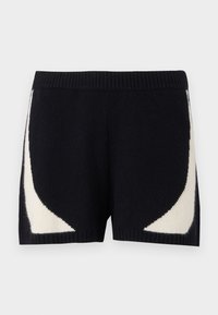 Knit kratke hlače u crnoj boji s kontrastnim kremastim geometrijskim uzorcima sa strane. Imaju rebrasti pojas i mekani tekstur.