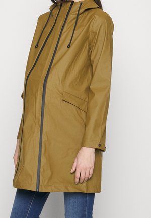 Khaki raincoat with a hood, made from water-resistant material. Features a front zipper, drawstring, and side pockets.
