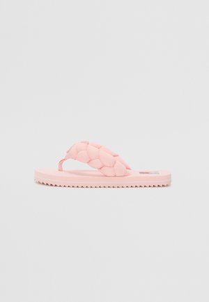 Rózsaszín strandpapucs, párnázott fonott pánttal, lapos talppal és fogazott peremmel a tapadásért. Könnyű, rugalmas anyagból készül.