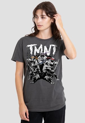 Gray cotton t-shirt featuring a graphic print of four masked characters with weapons, set against a brick wall design.