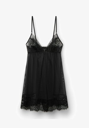 Black lace cami slip dress with adjustable straps, featuring sheer mesh fabric and a floral lace trim along the hem. Flowy silhouette.