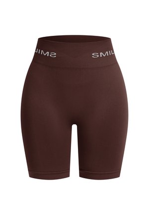 Brune shorts lavet af blød, strækbar stof. Har en bred talje med "SMIL" trykt i hvidt. Glat tekstur og længde til midt på låret.