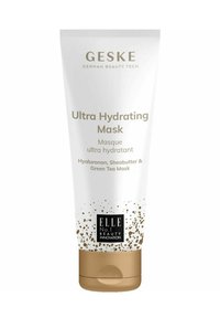 Maschera Ultra Idratante GESKE in un tubo bianco con dettagli dorati. Presenta testo che descrive gli ingredienti: ialuronano, burro di karité e tè verde.