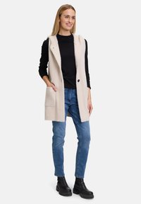 Amber & June MIT KAPUZE - Weste - beach beige