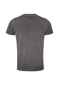 Harmaa lyhythihainen puuvillapaita pyöreällä kaula-aukolla, jossa on haalistunut pinta ja "TOP GUN" -logo takana kaula-aukon yläpuolella.