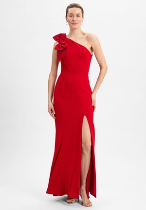 Rotes Ein-Schulter-Kleid mit einer großen Schleifendetail und einem hohen Schlitz. Hergestellt aus glattem Stoff, mit einer figurbetonten Silhouette und knöchellang.