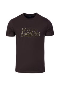 Brązowy t-shirt z krótkim rękawem wykonany z bawełny, z dużym złotym nadrukiem "KARL LAGERFELD" na przodzie, okrągły dekolt.