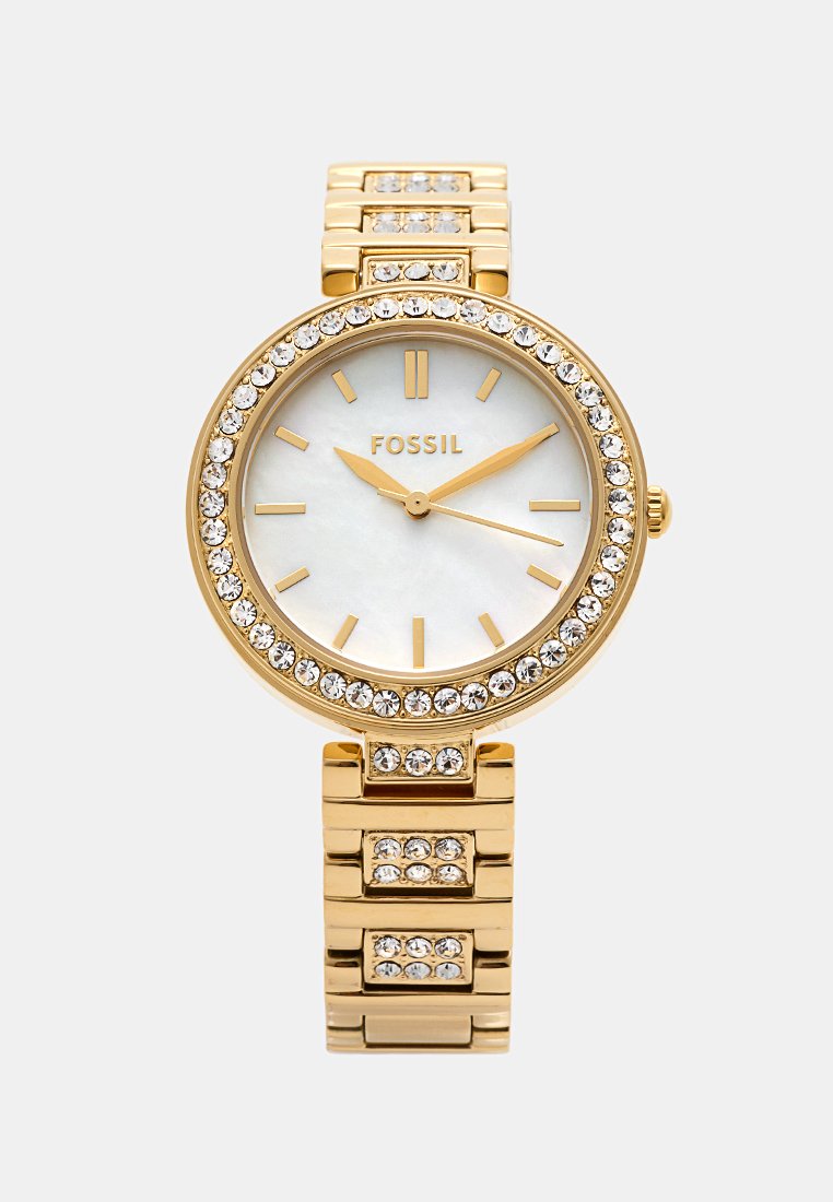 Gouden roestvrijstalen horloge met een ronde kast, witte parelmoer wijzerplaat, gouden indexen en kristallen versieringen. Schakelarmbandstijl.