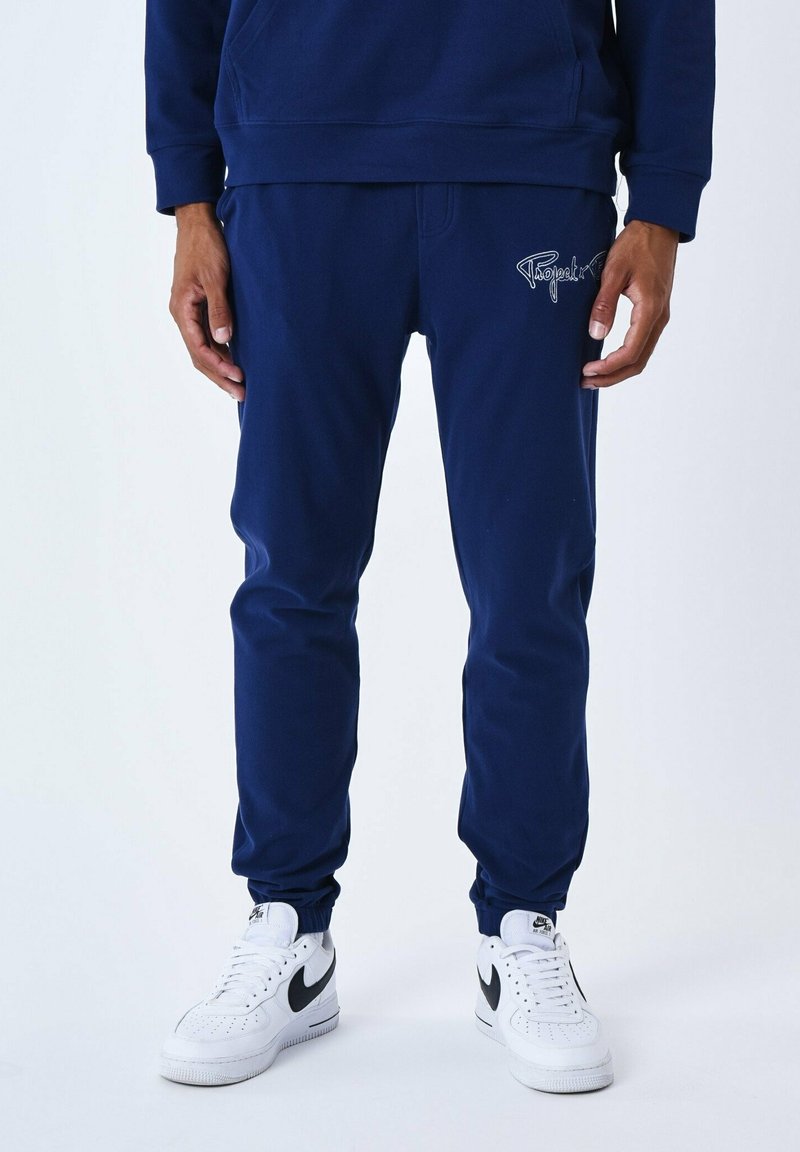 Project Tracksuit Project X Paris CONTOUR DU LOGO BRODÉ - Tracksuit bottoms - bleu nuit ...