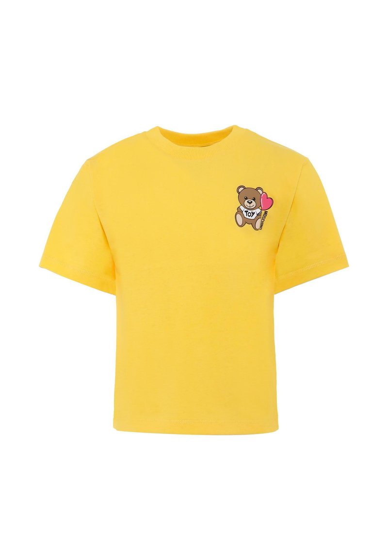 T-shirt en coton jaune avec des manches courtes et un col rond ; présente un motif imprimé d'un ours avec un cœur et le mot "TOY" sur la poitrine.