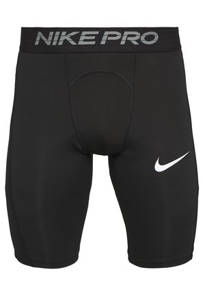 Shorts de compression Nike Pro noirs avec une large ceinture et le logo Nike swoosh blanc sur la cuisse droite.