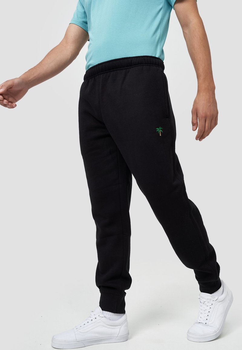 Herren Trainingsanzüge | MIKON PALME Jogginghose schwarz - NE27646 Herren Trainingsanzüge | MIKON PALME Jogginghose schwarz - NE27646