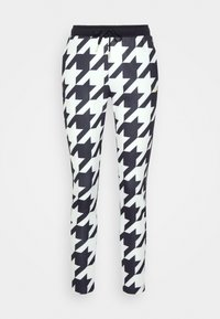 Černobílé jogger kalhoty s houndstooth vzorem, s elastickým pasem na šňůrku a bočními kapsami. Měkká tkanina, slim fit design.
