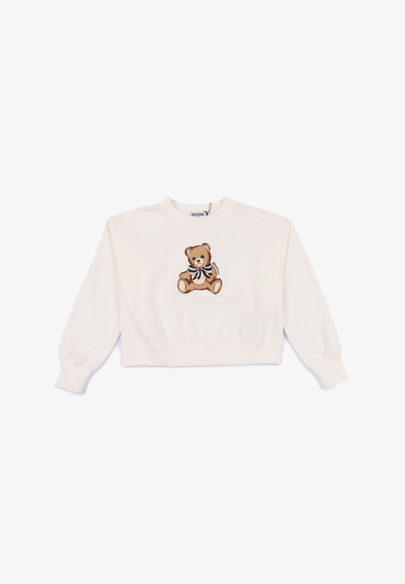 Sweatshirt bianco tagliato, realizzato in cotone, con un ricamo di un orso marrone con un fiocco in bianco e nero. Polsini e scollatura a costine.