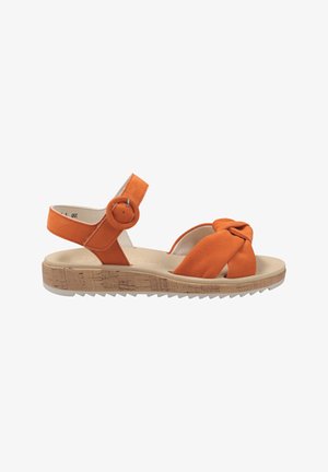Orange suede sandal with a knotted front design, adjustable ankle strap featuring a circular buckle, and a cork-textured platform sole.