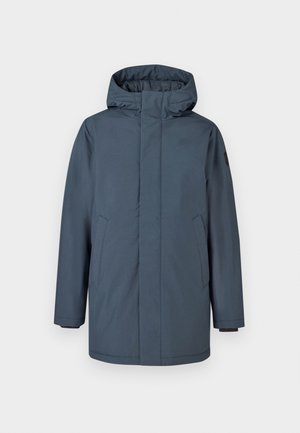 Tamsiai mėlynas vandeniui atsparus parka su gobtuvu, priekyje su užtrauktuku ir šoninėmis kišenėmis. Yra reguliuojami riešo džemperiai ir lygi tekstūra.