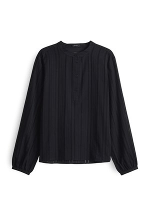 Zwarte lange mouwen shirt met verticale ribbelstructuur, ronde halslijn en knoopsluiting. Zachte stof met een iets losse pasvorm.