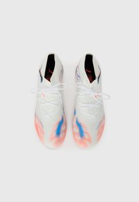 White athletic shoes with textured knit upper, featuring blue and orange accents, white laces, and a black inner lining.