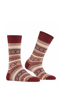 Czerwone skarpetki z wielokolorowymi paskami, w tym płatki śniegu i wzory geometryczne. Żebrowane ściągacze, miękka tekstura i długość typu crew.