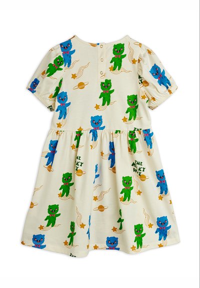 Φόρεμα μωρού σε κρεμ απόχρωση με μπλε και πράσινες απεικονίσεις αρκούδων, κίτρινα αστέρια, πλανήτες και μοτίβο κειμένου "Ο Γαλαξίας". Κουμπιά στην πλάτη.