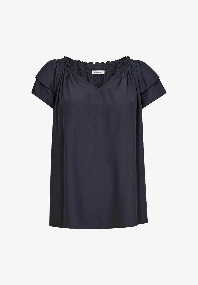 Blusa blu navy con scollatura a V, maniche corte a sbuffo e dettagli arricciati alla scollatura. Realizzata in un tessuto leggero.