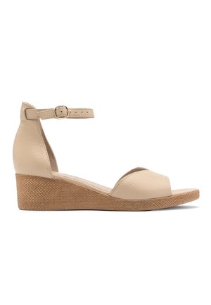 Beige leather wedge sandals with an ankle strap, open toe design, and textured brown wedge heel. Features a cushioned insole for comfort.
