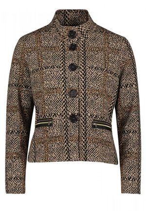 Veste femme à boutons, col montant, motif imprimé animal et deux poches zippées à l'avant en tons noir, marron et beige.