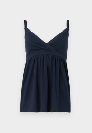Camisole bleu marine avec bretelles réglables, présentant un décolleté en V bordé de dentelle et un corsage froncé pour un ajustement décontracté. Tissu doux et extensible.