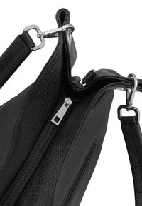 Black textured leather handbag with silver zipper and detachable strap clips shown close-up on a white background.