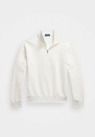 Svijetlosiva zip-up dukserica izrađena od mješavine pamuka. Ima stojećeg kragnu te rebraste rukave i porub. Mali logo na prsima.