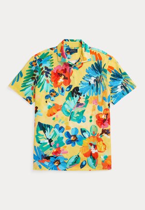 Short-sleeve polo shirt made of fabric, featuring a bright yellow base with colorful floral patterns in blue, red, and green hues.