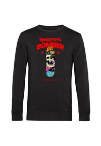 Svart sweatshirt med långa ärmar, med en färgglad dödskallegrafik och texten "STREET BOMBER 1990" i fet röd och gul.