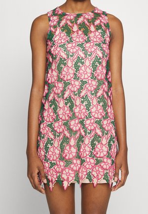 Sleeveless mini dress with layered pink floral lace over green fabric, featuring scalloped hem and round neckline.