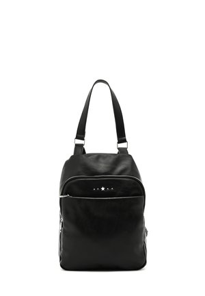 Black leather backpack with a rounded shape, front zip pocket, and star accent detail. Features dual adjustable shoulder straps.