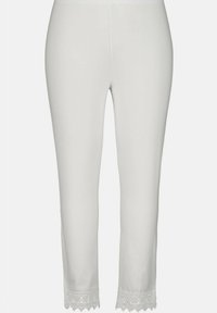 White slim-fit leggings with lace trim at the ankle hems, displayed against a plain light background.