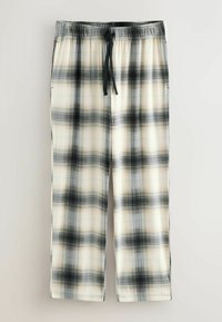 Pantalons de détente à motif écossais en crème, noir et gris ; fabriqués en tissu doux avec une taille élastique et un cordon de serrage ajustable. Comprend deux poches latérales.