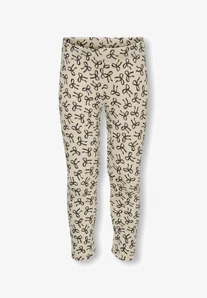 Leggings i creme med ribbet tekstur, prydet med et gentaget sort saks mønster. Elastisk talje, tætsiddende design, ankellang stil.
