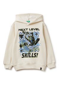 Béžová mikina s kapucí a grafickým potiskem, který zobrazuje skateboard, postavu a text "NEXT LEVEL SKILLS!" v černé a neonově zelené barvě.