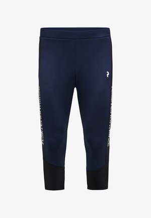 Marineblaue Sportleggings mit enger Passform, schwarzen Seitenteilen und weißem Branding entlang der äußeren Nähte. Glatte Textur.