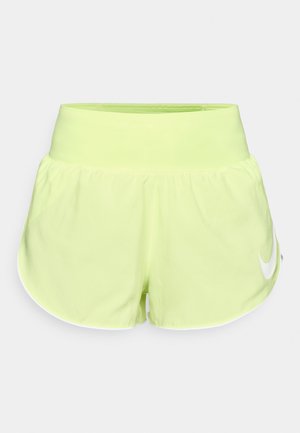 Sieviešu Nike skrējiena šorti spilgtā neona dzeltenā krāsā ar gludu tekstūru, platu elastīgu jostasvietu un baltu logotipa akcents kreisajā pusē.