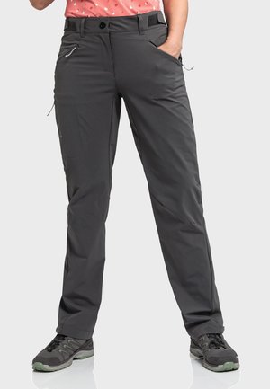 Gray outdoor pants with a straight-leg design, featuring multiple pockets, zip closures, and adjustable waist. Worn with black hiking shoes.