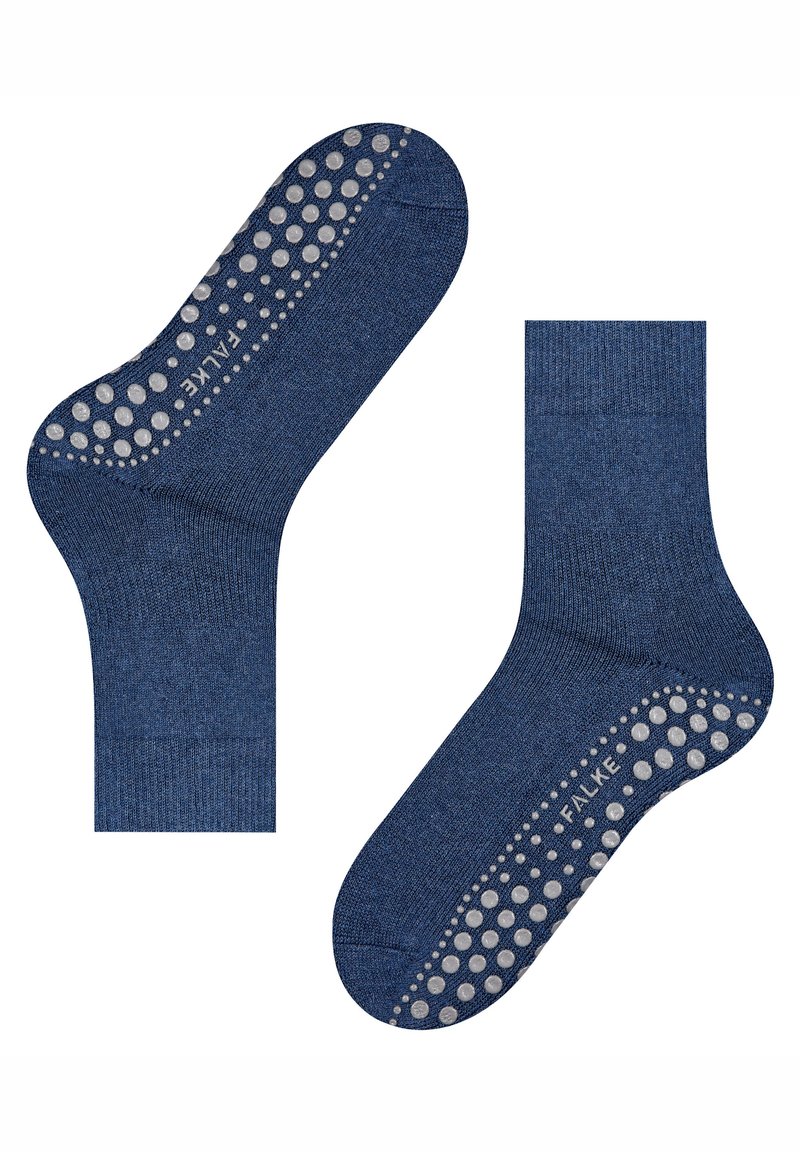 Dos calcetines antideslizantes azules con puntos de agarre blancos texturizados y la marca "FALKE" en la zona de la suela, mostrados uno al lado del otro sobre un fondo blanco.