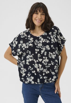 Navy floral blouse in lightweight fabric, featuring short sleeves, a round neckline, and a loose fit. Flowers in light colors throughout.