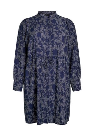Marineblauwe jurk met een bloemenpatroon in het wit. Beschikt over een knoopsluiting aan de voorkant, lange mouwen, een kraag en een tailleband. Gemaakt van zachte stof.