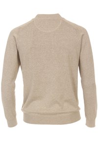 Beige sweater med rund halsudskæring, lange ærmer, ribbede manchetter og kant, lavet af et blødt, let stof med en glat overflade.